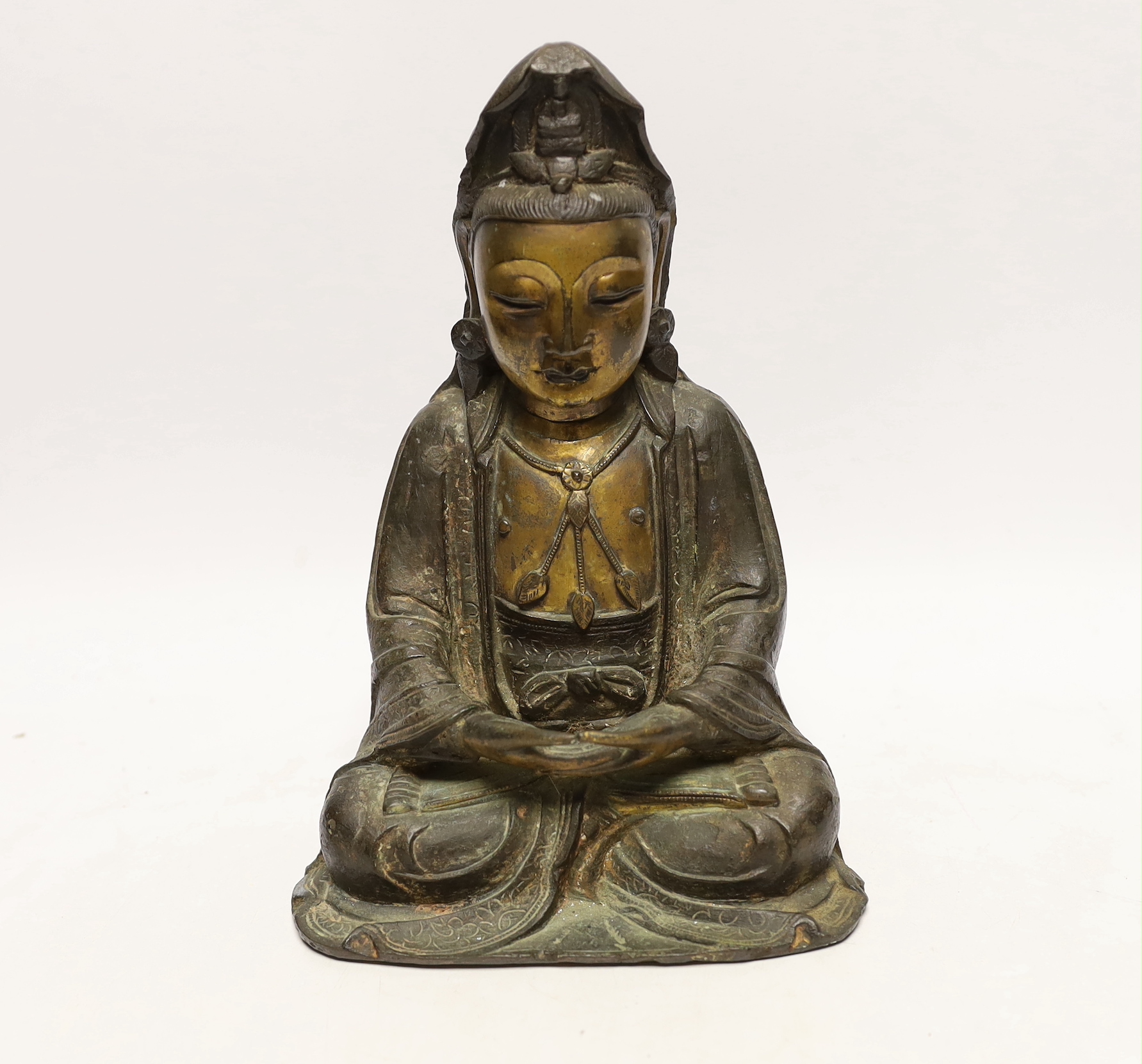 A Chinese Ming gilt bronze figure of Xi Wangmu, Queen Mother of the West, late 16th / early 17th century, Provenance: bought from the 50th Chelsea Antiques Fair, R & D Coombes, 1980, 24cm high